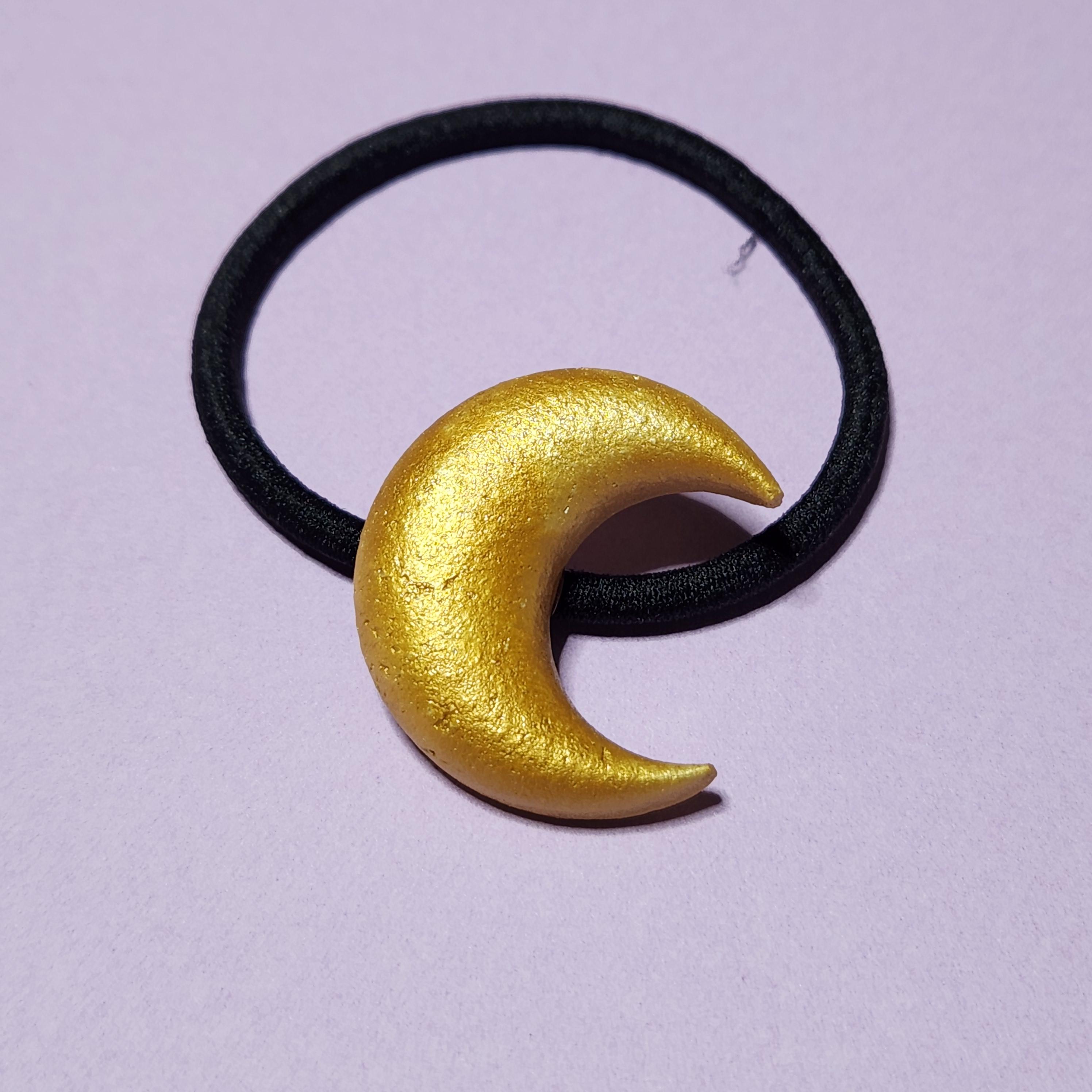 【ハンドメイド】陶器の三日月ヘアゴム（金色）1枚目の画像